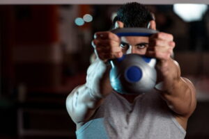 Man working out with kettle bell