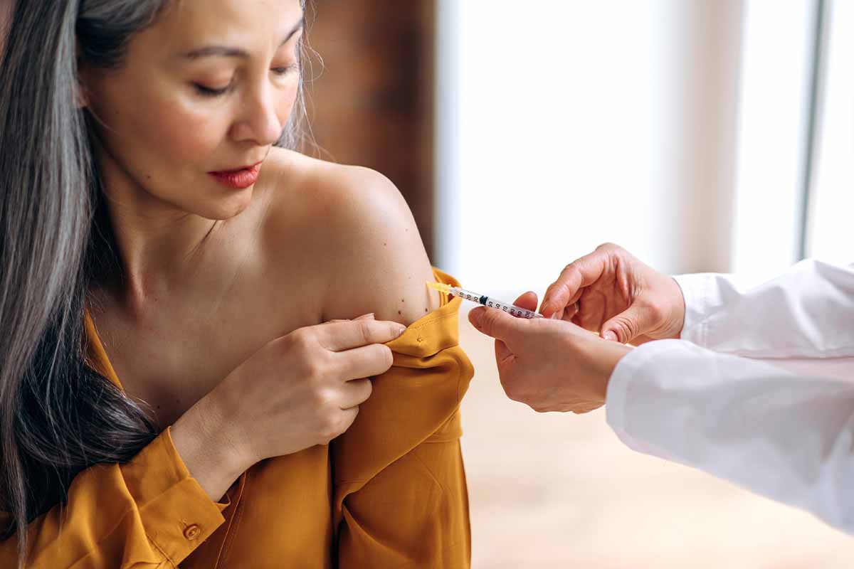A woman getting vitamin injections in Charlotte